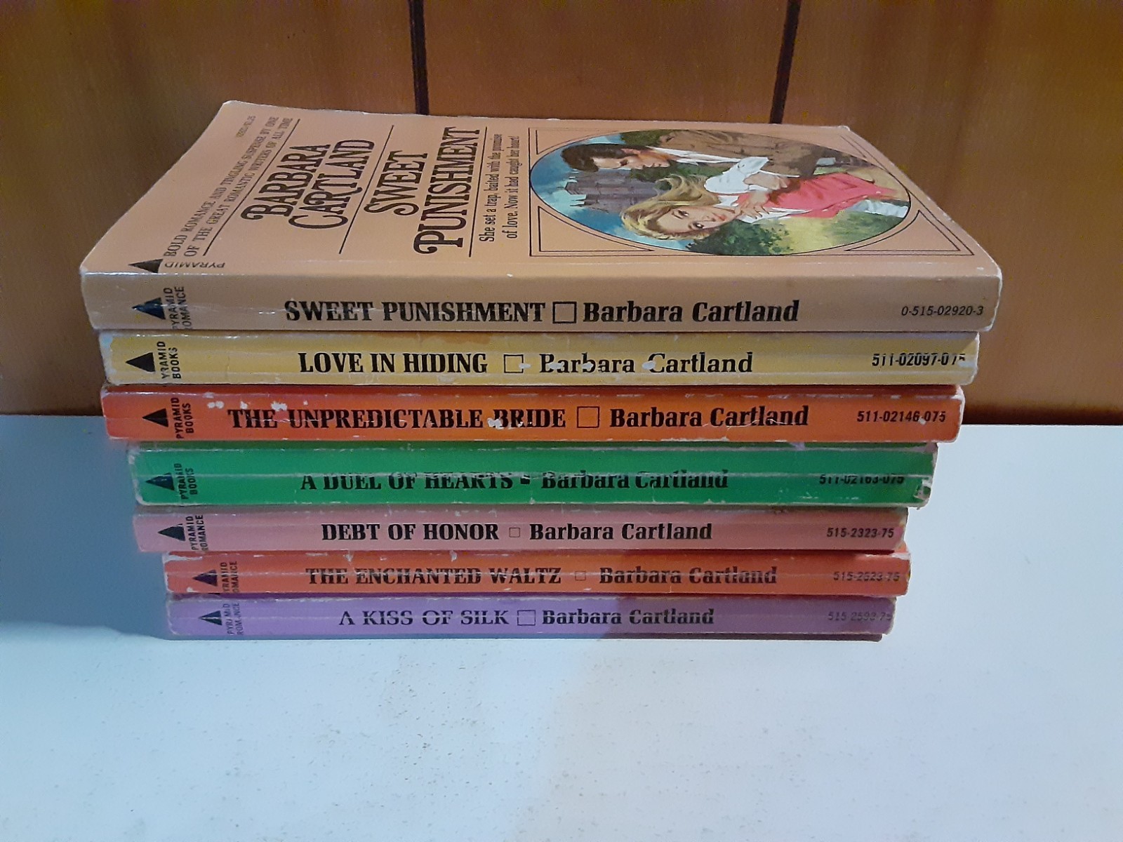 7 Barbara Cartland Paperback Books A Kiss In Silk, Love In Hiding, Debt Of Honor
