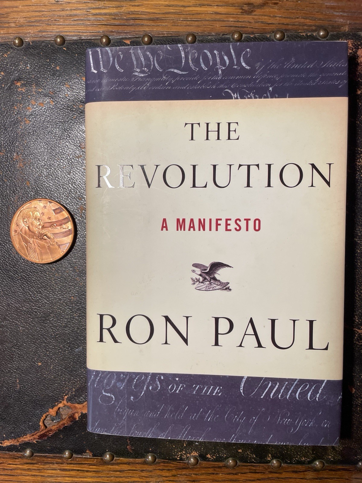 Signed The Revolution: A Manifesto by Ron Paul – Hardcover + 1oz Copper Round