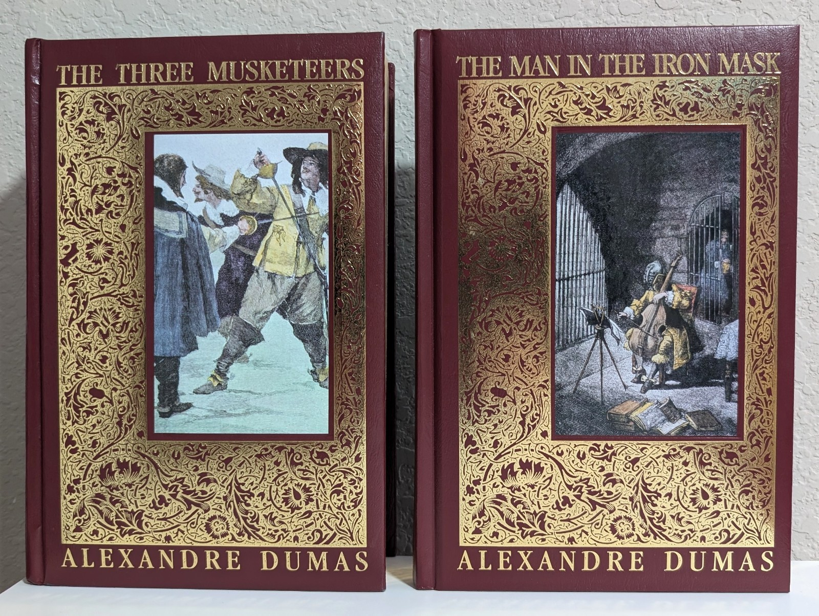 Alexandre Dumas = THREE MUSKETEERS + MAN IN THE IRON MASK = 2 padded leather HC